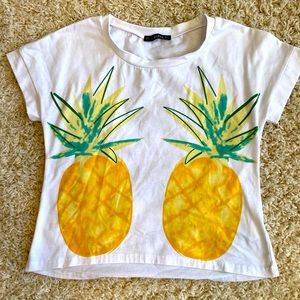 Small, white pineapple tee shirt